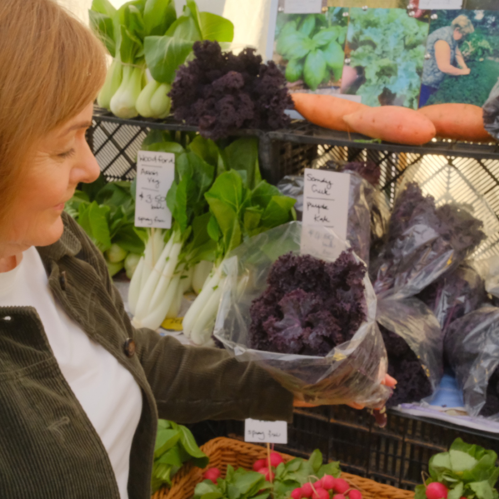 Dorelle Thompson, metabolic health dietitian in Brisbane, holding fresh kale