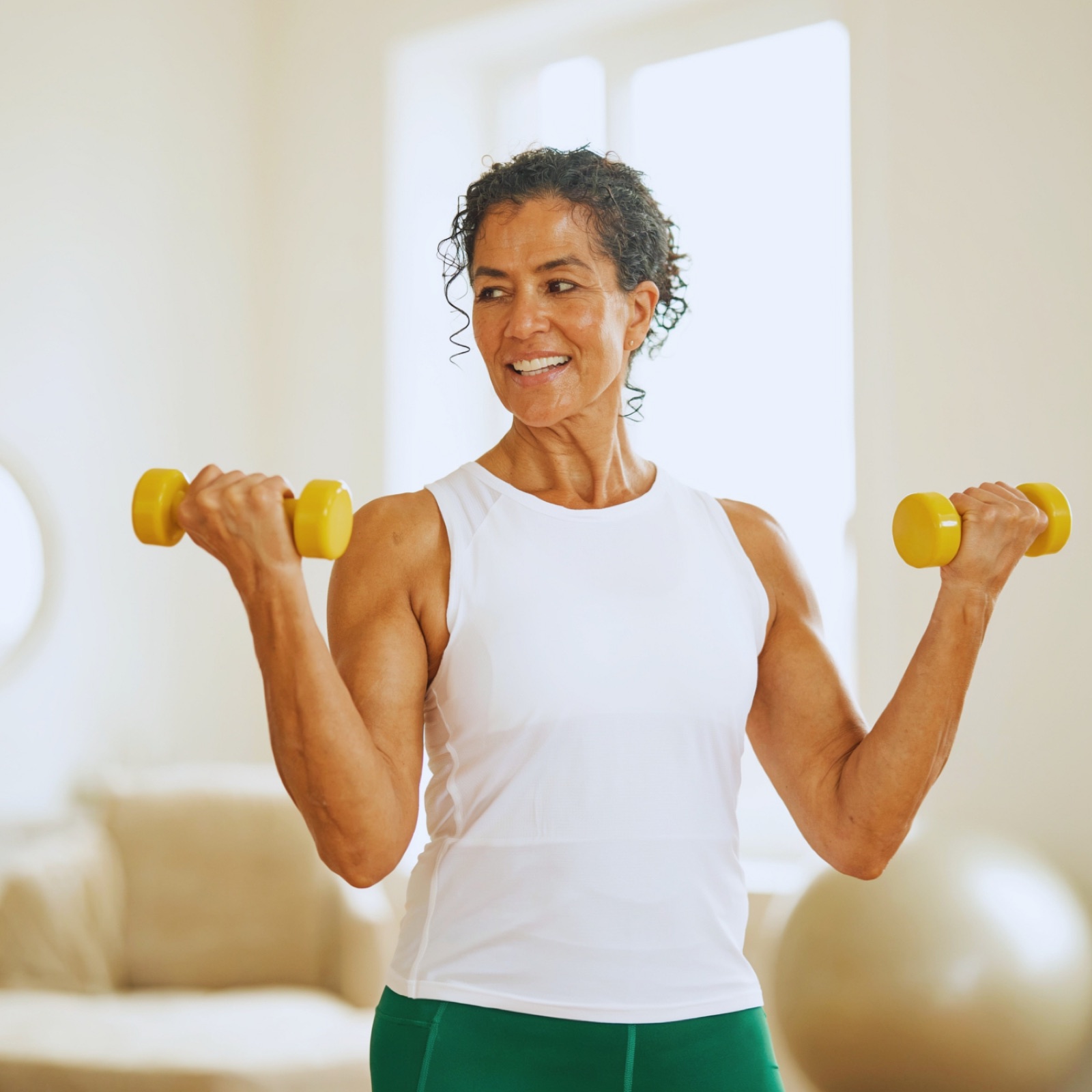 An older adult lifting light weights, nutrition for muscle strength and bone health